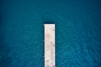 White Wooden Dock Above Water