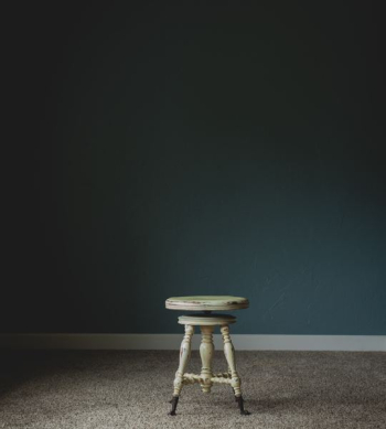 white wooden stool chair near wall white wooden stool chair near wall