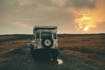 white wrangler on road during sunset white wrangler on road during sunset