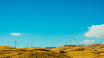 Wind Turbines Under Blue Sky Wind Turbines Under Blue Sky