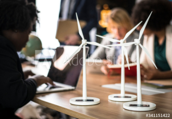 Windmill models on a meeting table Windmill models on a meeting table