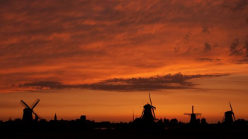 windmill silhouette during golden house windmill silhouette during golden house