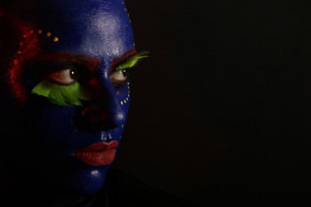 Woman's Face Covered with Face Paint Woman's Face Covered with Face Paint