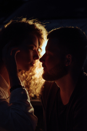 Woman About to Kiss Man