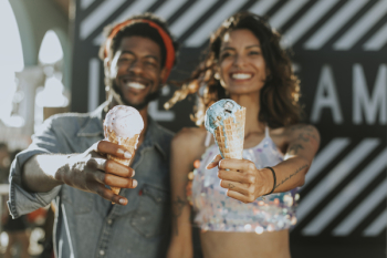 Woman and Man Holding Ice Creams Woman and Man Holding Ice Creams