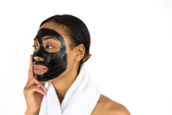 Woman Applying Face Mask Woman Applying Face Mask
