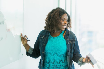 Woman At Whiteboard Happy Woman At Whiteboard Happy