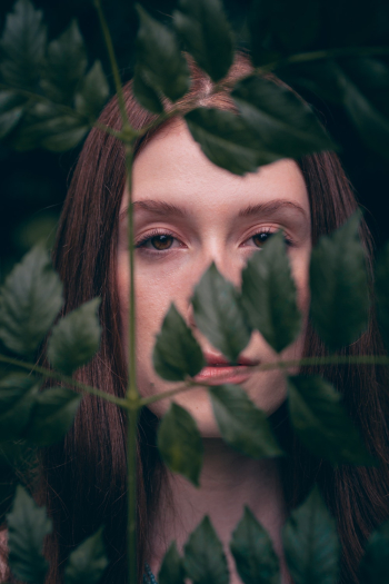 Woman Behind Green Leaves Woman Behind Green Leaves