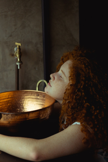 Woman Beside Faucet Woman Beside Faucet
