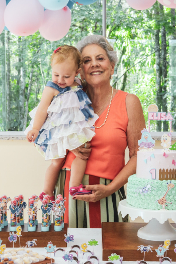 Woman Carrying a Child Standing Beside Table Woman Carrying a Child Standing Beside Table