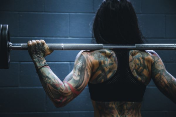 woman carrying barbell woman carrying barbell