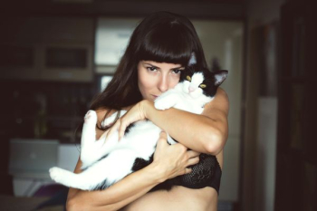 woman carrying cat woman carrying cat