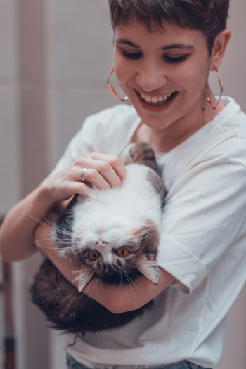 Woman Carrying Her Cat Woman Carrying Her Cat