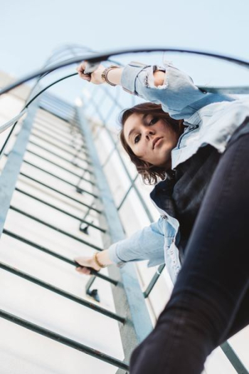 woman climbing on ladder