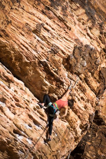 woman climbing rocky mountain woman climbing rocky mountain