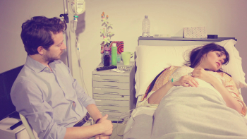 Woman Crying In Hospital Bed Comforted By Husband Retro Style ...