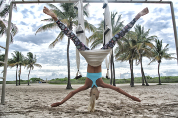 Woman Doing Anti-Gravity Yoga Woman Doing Anti-Gravity Yoga