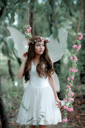 Woman Doing Photoshoot While In Fairy Costume Woman Doing Photoshoot While In Fairy Costume