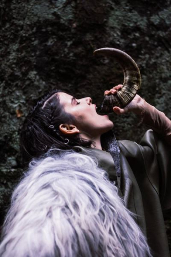 Woman Drinking Water On Animal Horn Woman Drinking Water On Animal Horn