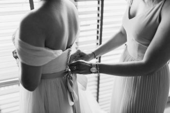 Woman Fixing Dress Of Woman Woman Fixing Dress Of Woman