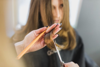 Woman Getting Hair Cut At Salon Woman Getting Hair Cut At Salon