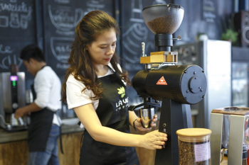 Woman Grinding Coffee Bean Woman Grinding Coffee Bean