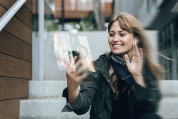 Woman having a video call on smartphone Woman having a video call on smartphone