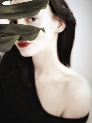 Woman Hiding Behind Plant Woman Hiding Behind Plant