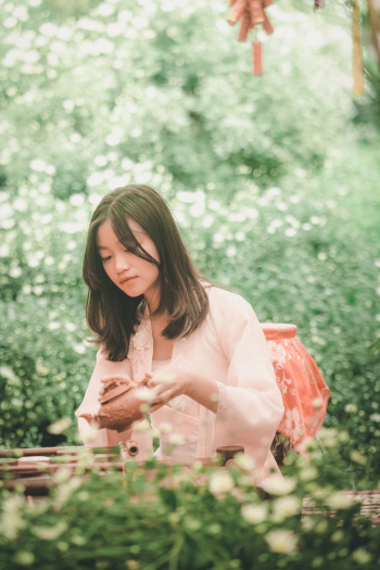 Woman Holding a Clay Teapot Woman Holding a Clay Teapot
