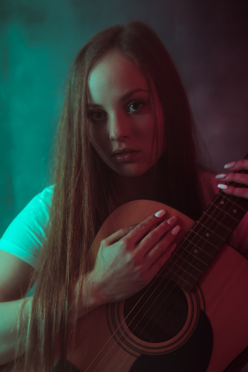 Woman Holding Acoustic Guitar Woman Holding Acoustic Guitar