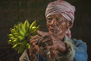 Woman Holding Bananas Figurine Woman Holding Bananas Figurine