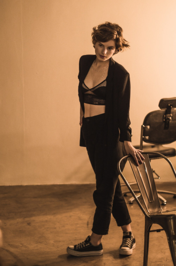 Woman Holding Black Chair Woman Holding Black Chair