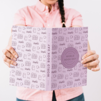 Woman holding book cover mockup Free Psd