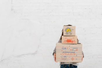 Woman holding boxes with copyspace