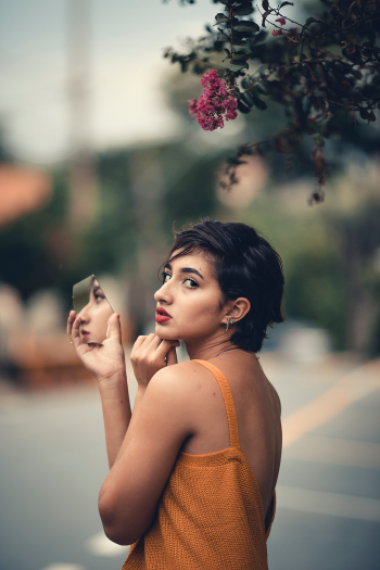 Woman Holding Broken Mirror Woman Holding Broken Mirror