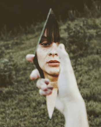 Woman Holding Broken Mirror Woman Holding Broken Mirror