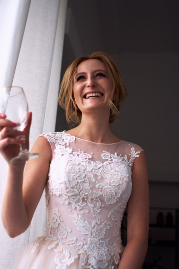 Woman Holding Clear Glass Footed Cup Woman Holding Clear Glass Footed Cup