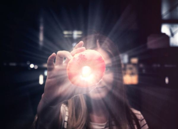 woman holding donut woman holding donut