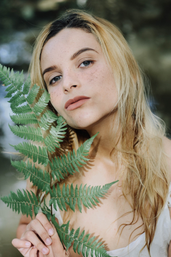 Woman Holding Fern Plant Woman Holding Fern Plant