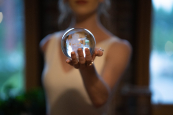 woman holding glass ball woman holding glass ball