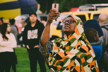 Woman Holding Gold Smartphone Woman Holding Gold Smartphone