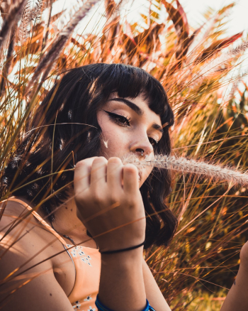 Woman Holding Grass
