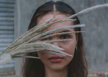 Woman Holding Grass