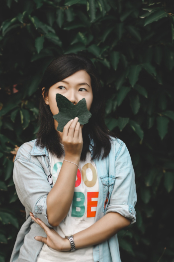 Woman Holding Green Leaf Woman Holding Green Leaf