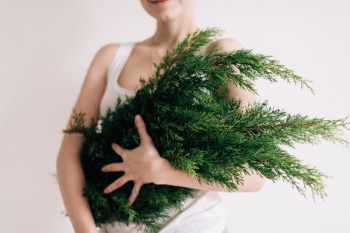 woman holding green leafs woman holding green leafs