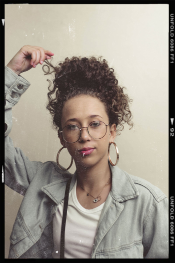 Woman Holding Her Curly Hair Screenshot Woman Holding Her Curly Hair Screenshot