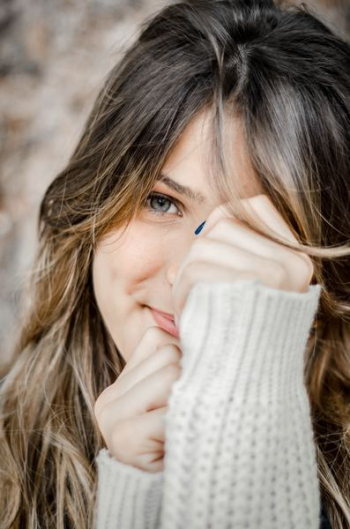 woman holding her face woman holding her face