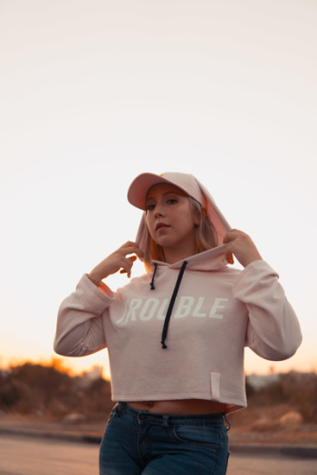 Woman Holding Hoodie Woman Holding Hoodie