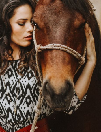 woman holding horse head woman holding horse head