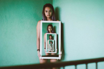 woman holding mirror woman holding mirror